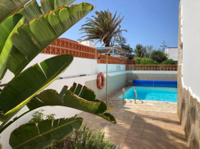 Beach house with the heated pool next to Rocky Point